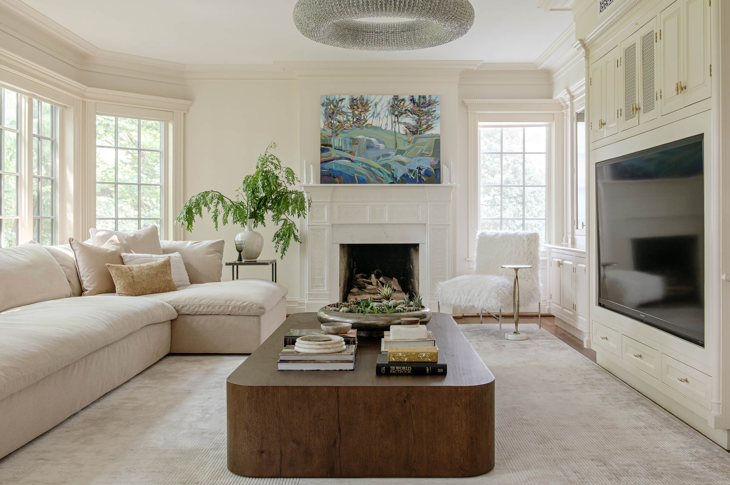 A serene Toronto living room designed with quiet luxury—neutral tones, sculptural lighting, and custom millwork.